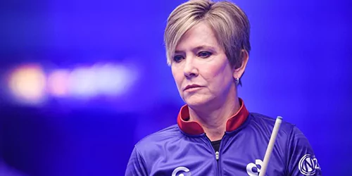 allison fisher woman spoting a billiard table holding a billard stick